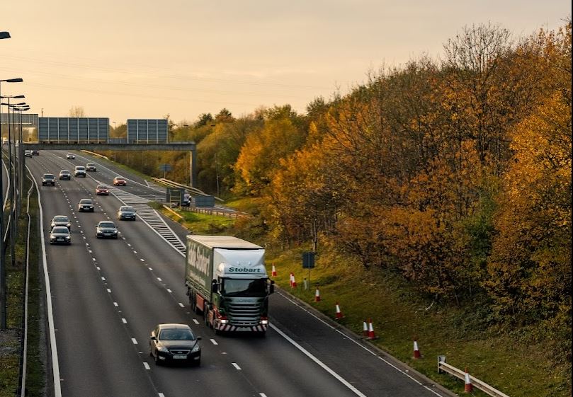 Picture of cars and lorries driving along the motorway.