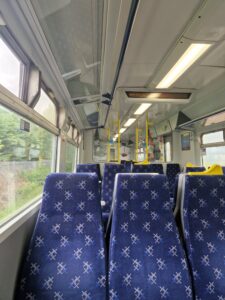 interior of train carriage with empty seats