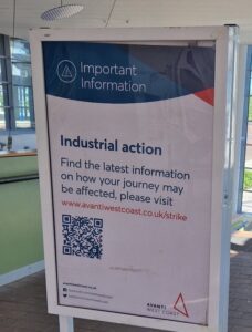 Strike poster at Stockport with QR code for more information