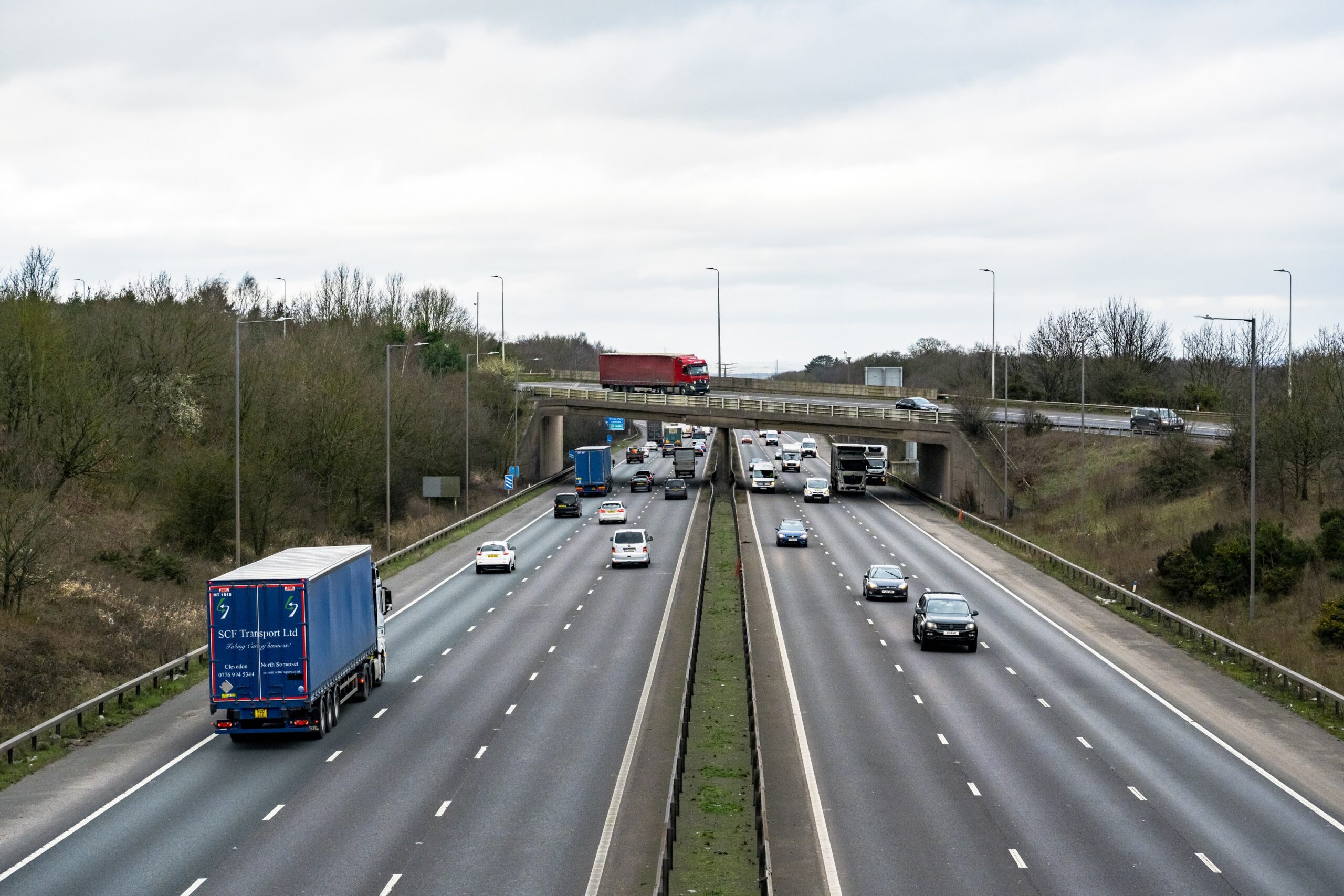Cars and lorries driving along the motorway.