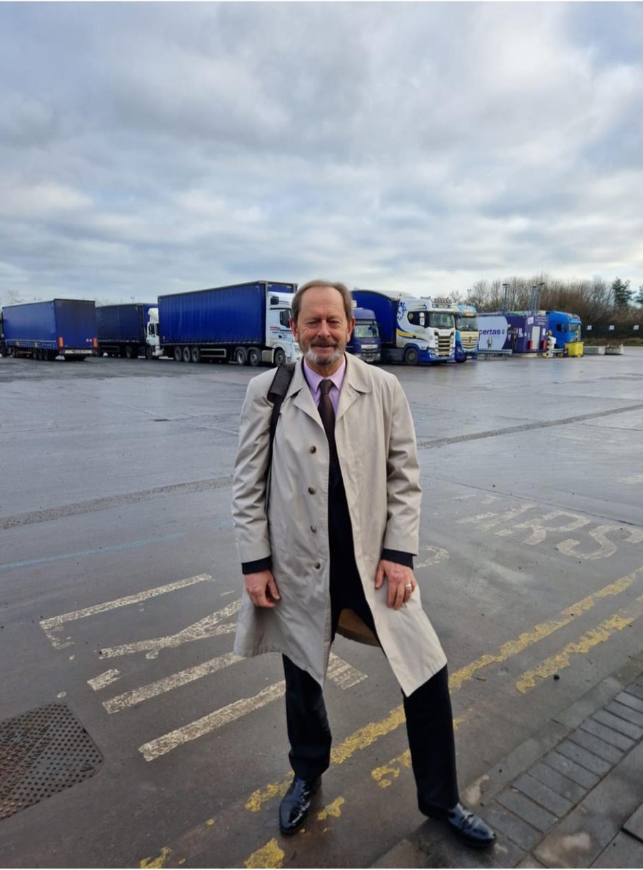 Anthony Smith standing at a service station for lorry drivers.