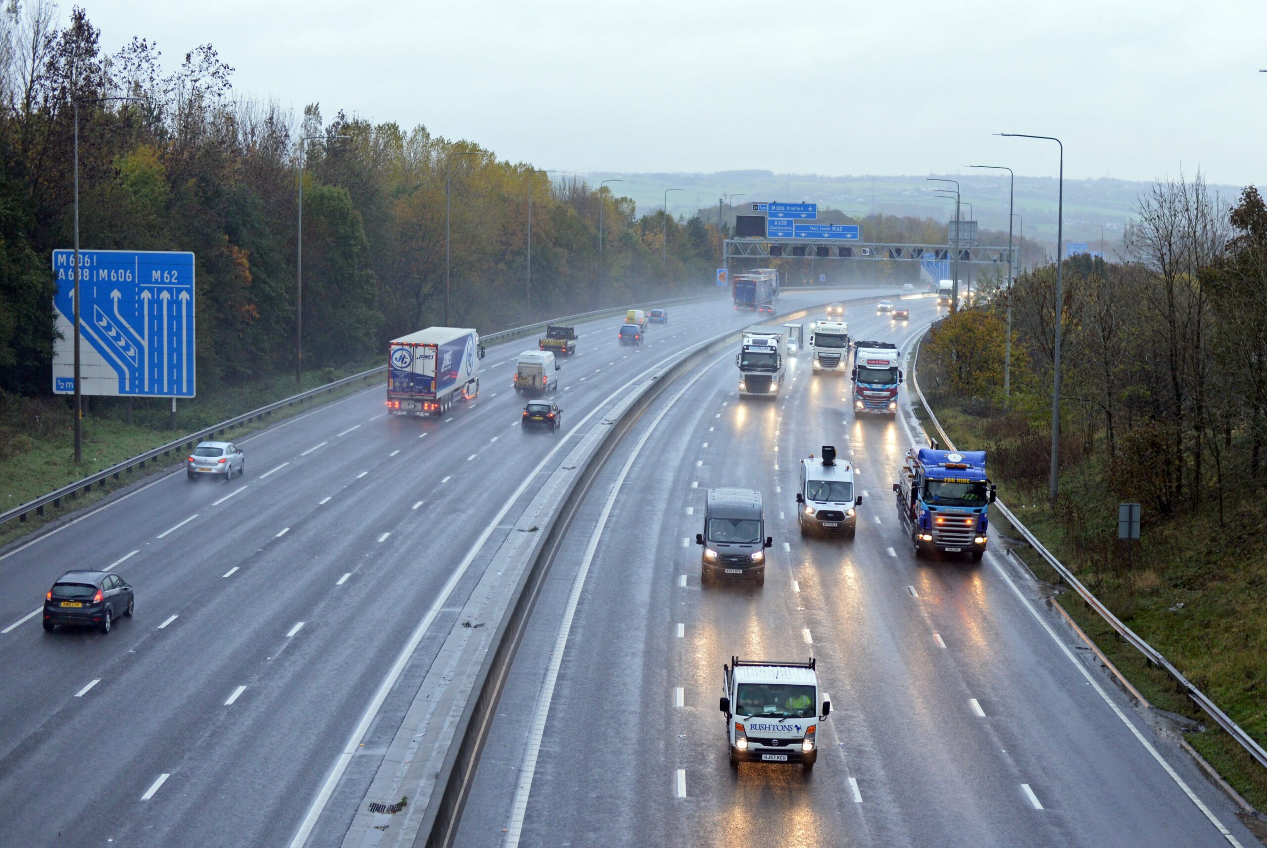 Cars and lorries driving along a motorway.